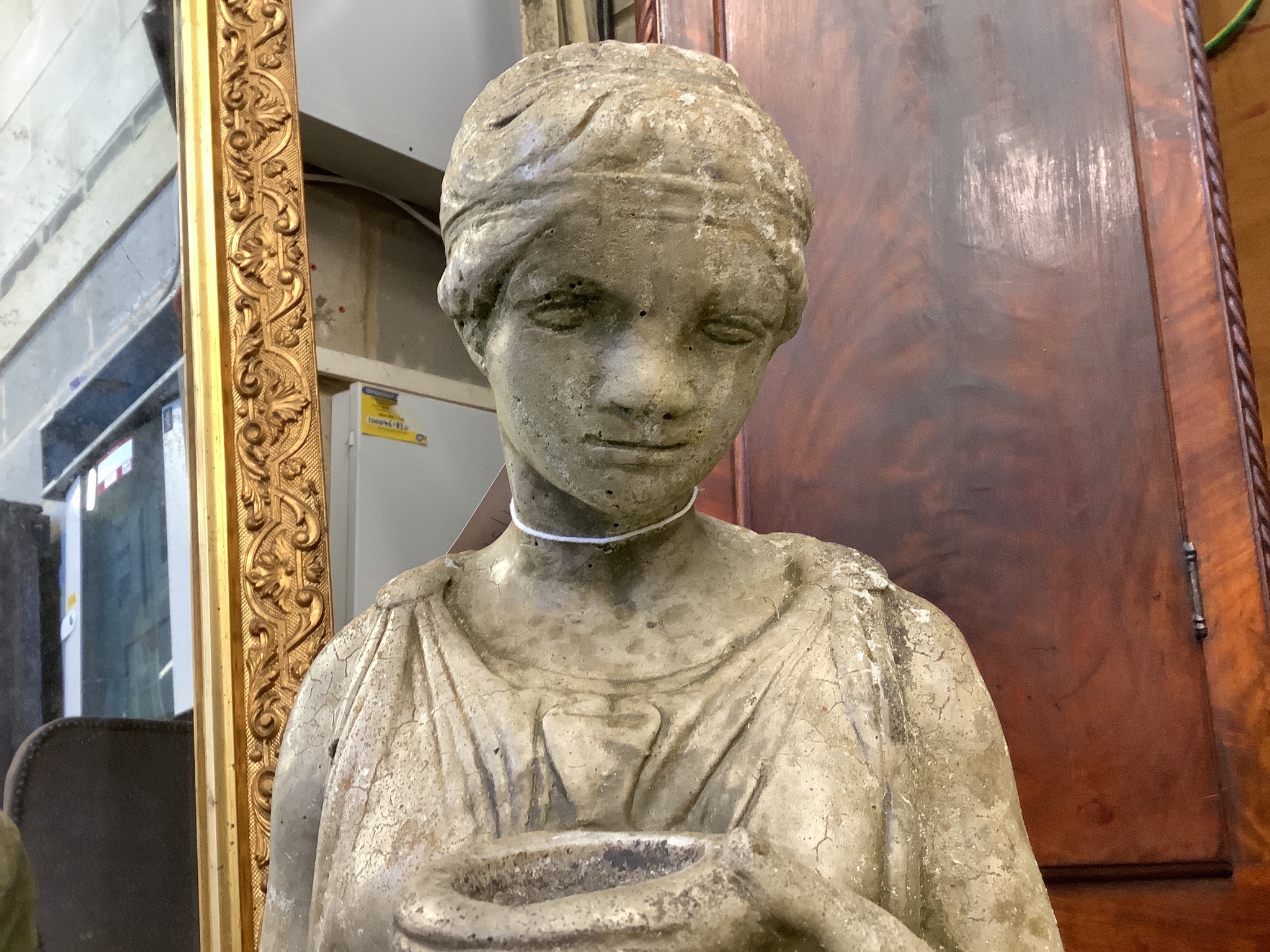 A reconstituted stone garden ornament of a lady with ewer, height 100cm